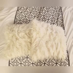 White fuzzy throw pillows (2)